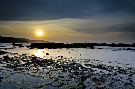 Sunset on Sawarna beach, Indonesia の写真素材