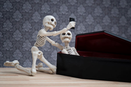 Selfie, skeleton self portrait with his dead friend in the coffinの写真素材