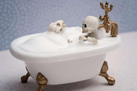 Skeleton kid and skeleton dog getting bath