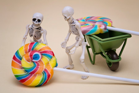Two skeletons hauling lollipopの写真素材