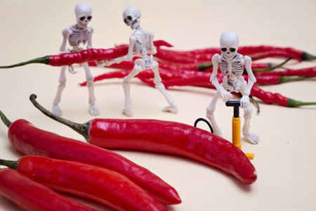 A skeleton pumping red chili pepperの写真素材