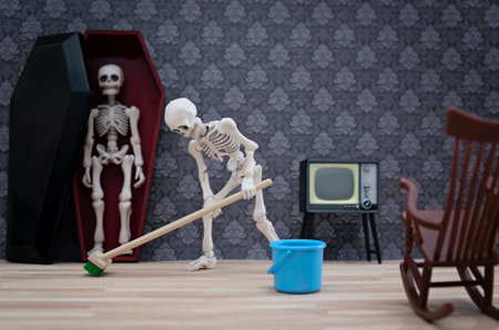 Skeleton cleaning the living roomの写真素材