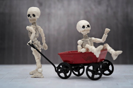 Skeleton kids playing toy wagonの写真素材