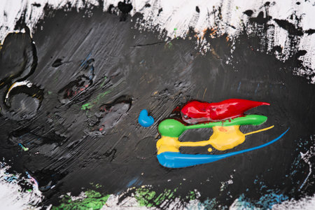 Colorful paste and black background paintingの写真素材