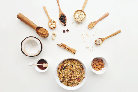 Cashew nuts, raisins, oats, honey, almonds, cinnamon and seedsの写真素材