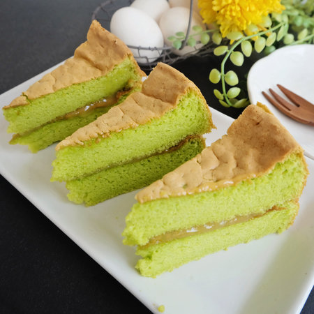 Pandan sponge cakes and eggs for breakfastの写真素材