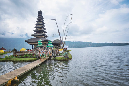 BALI, INDONESIA - March 24, 2017; Pura Ulun Danu Bratan is a Shivaite and water temple on Bali. This temple is used for offerings ceremony to the Balinese goddess Dewi Danu.のeditorial素材