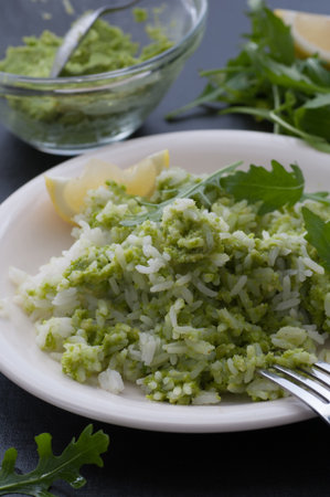 Homemade pea pesto served with rice.の写真素材