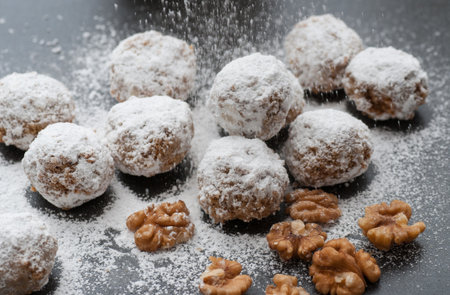 Homemade walnut snowball cookies with powdered sugar.の写真素材