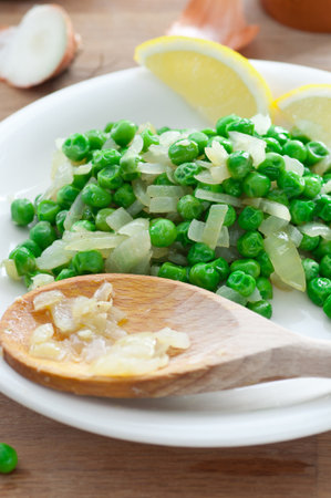 Chicken broth cooked green peas with fried onion, garlic and spices.の写真素材