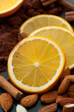 Fresh orange slices, almonds, cocoa and cinnamon.の写真素材