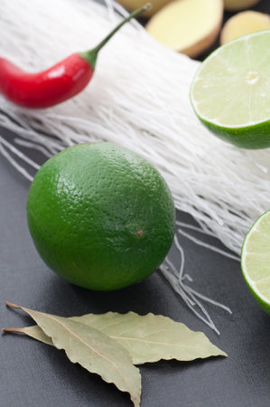 Lime, bay leafs, glass noodles, chili and ginger.の写真素材