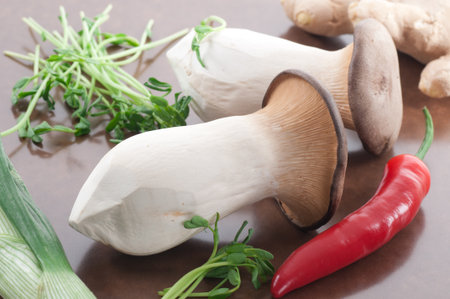 King oyster mushrooms, red chili, pea shoots, leek and fresh ginger.の写真素材
