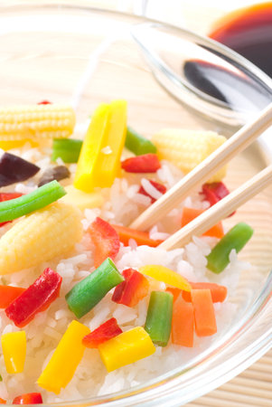 Rice with cooked vegetables and soy sauce.の写真素材