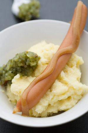 Boiled sausage with homemade mash and sweet pickle relish.の写真素材