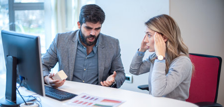 Business conflict. Business colleagues arguing and yelling at each other in office. Abuse and...