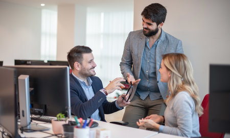 Business people laughing at funny joke in office. Happy colleagues staff group having fun at office...
