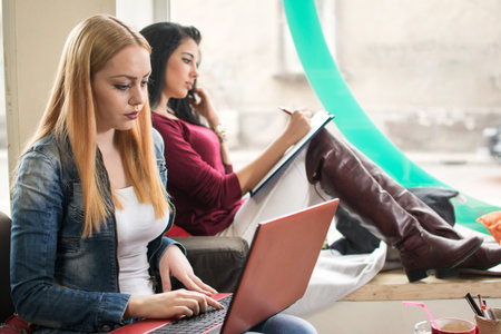 Two female students learning at university