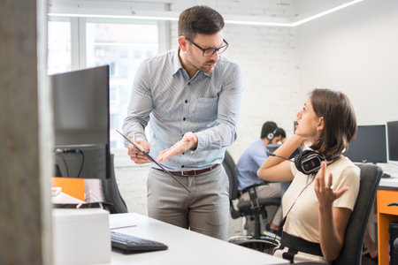 Business conflict. Business people arguing about document at the office.