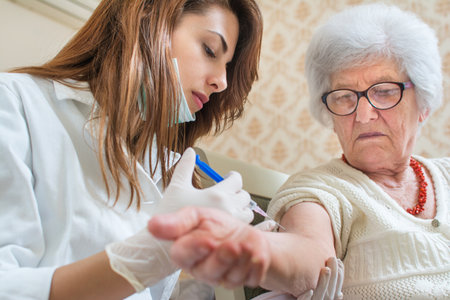 Nurse giving injection to senior woman. Home care