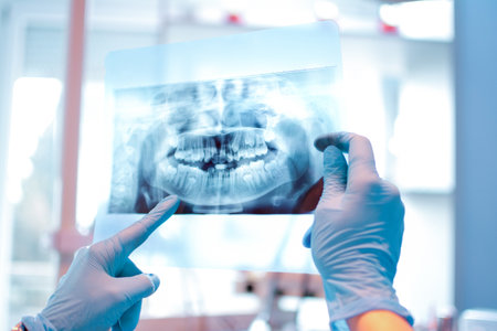 Female dentist holding a dental X-Ray