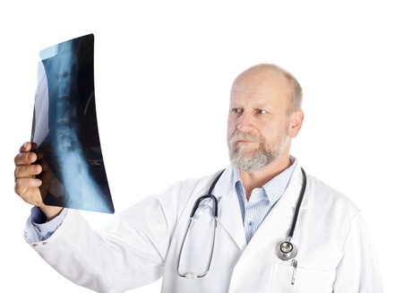 Serious doctor is holding an vertebrae X-ray fileの写真素材