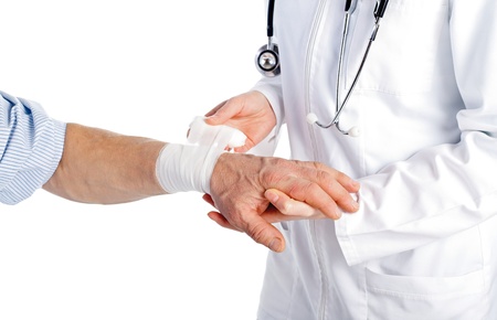 Confident doctor heals the patients broken handの写真素材