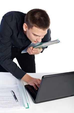 Young business is working on the notebookの写真素材