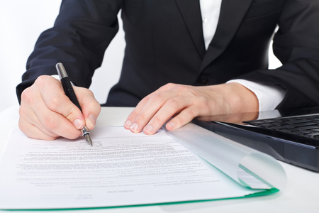 The businessman is signing on the papersの写真素材