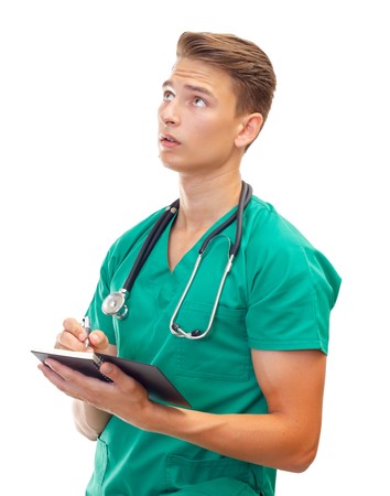 Portrait of a thoughtful male doctor on isolated backgroundの写真素材