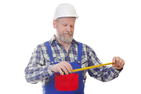 Portrait of a worker useing a tape measure