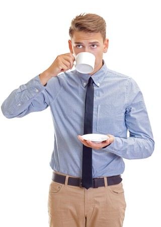 portrait of a businessman who is drinking his morning coffeeの写真素材