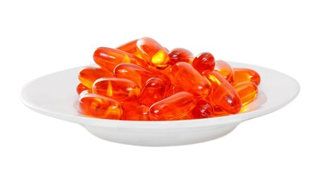 Close up of a plate full with pills on isolated backgroundの写真素材