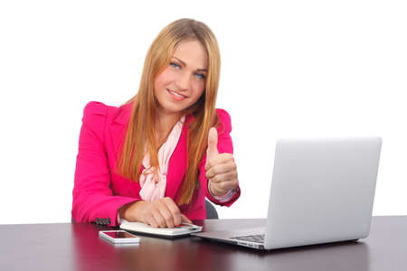 Portrait of a confident smiling businesswoman with thumb upの写真素材