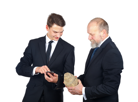 Portrait of two man checking a snail fossilの写真素材