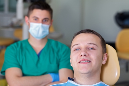 Patient with a dental braces at the clinicの写真素材