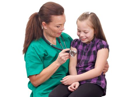 Portrait of a woman doctor holding a child on her lapの写真素材