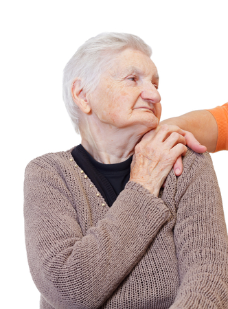 A woman hand touching an elderly shoulderの写真素材