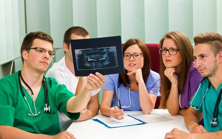 Picture of a medical team analyzing an X-rayの写真素材