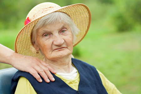 Handicapped elderly woman sitting in a wheelchairの写真素材