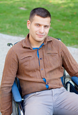 Picture of a handicap businessman with his wheelchairの写真素材