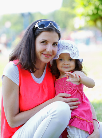 Beautiful young mother playing with her daughterの写真素材