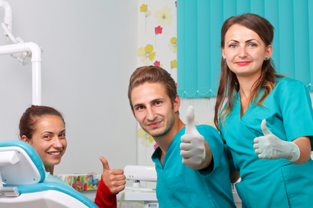 The dentist is checking the patient's mouthの写真素材