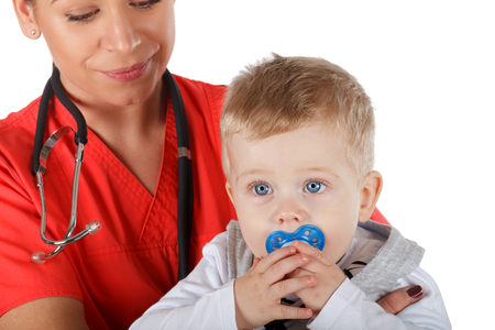 Picture of a pediatrician holding a childの写真素材