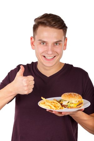 Picture of a man eating a delicious cheeseburgerの写真素材