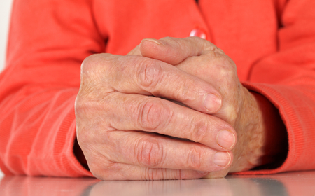 Close up  of a wrinkled elderly handの写真素材