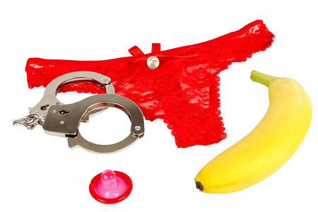 Picture of a handcuff, a panty,  a banana and a condomの写真素材