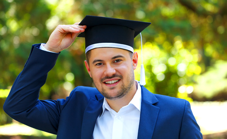 Happy graduateing student wearing graduation  hatの写真素材