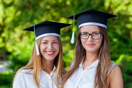 photo of two beautiful women after graduatingの写真素材