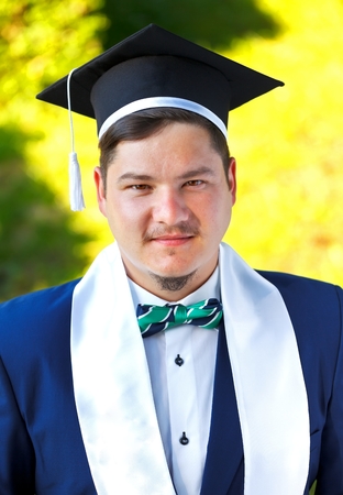 Happy graduateing student wearing graduation  hatの写真素材